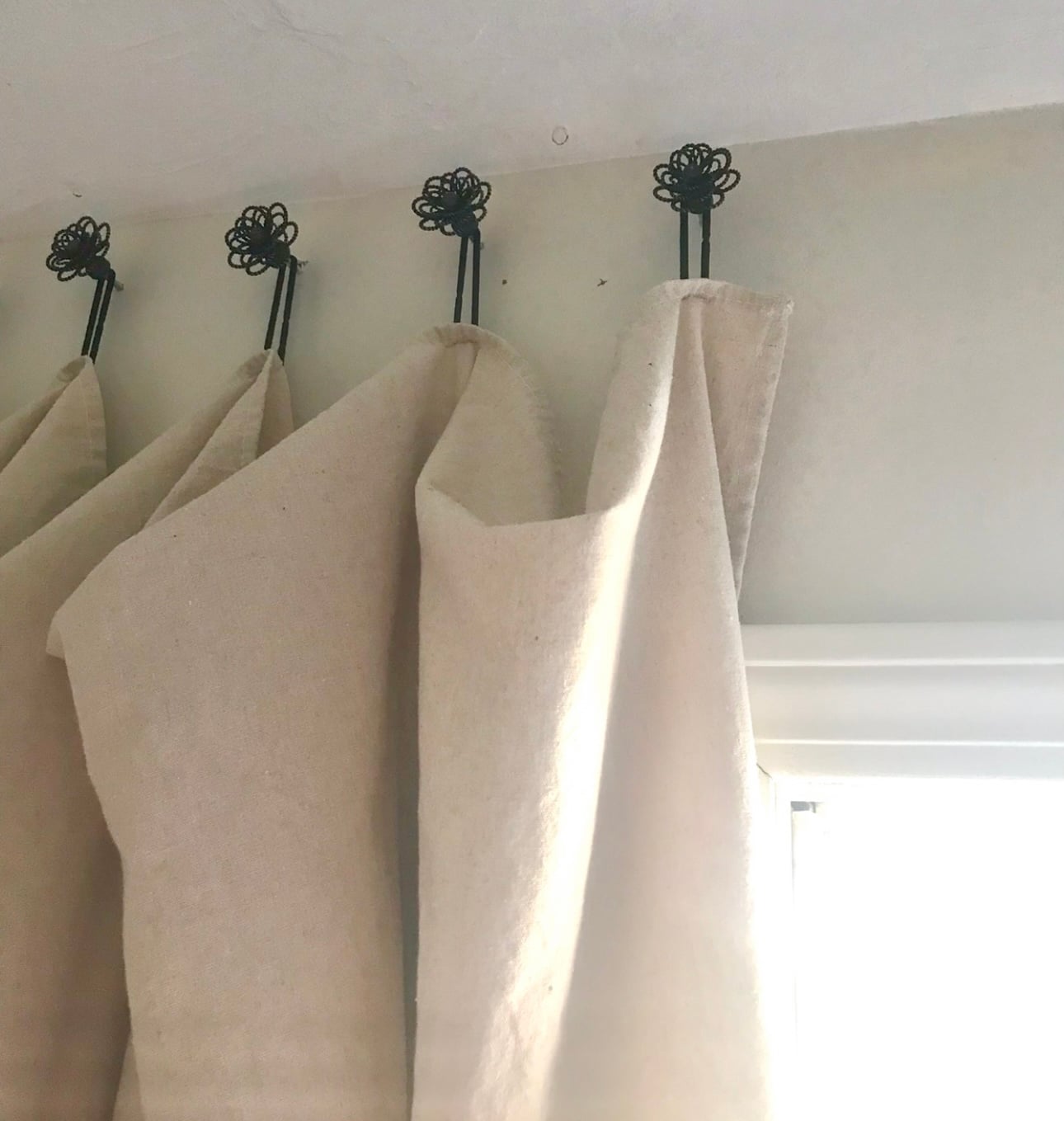 The drawer pulls installed over one window.