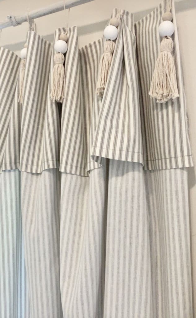 ticking stripe curtains with tassels. 