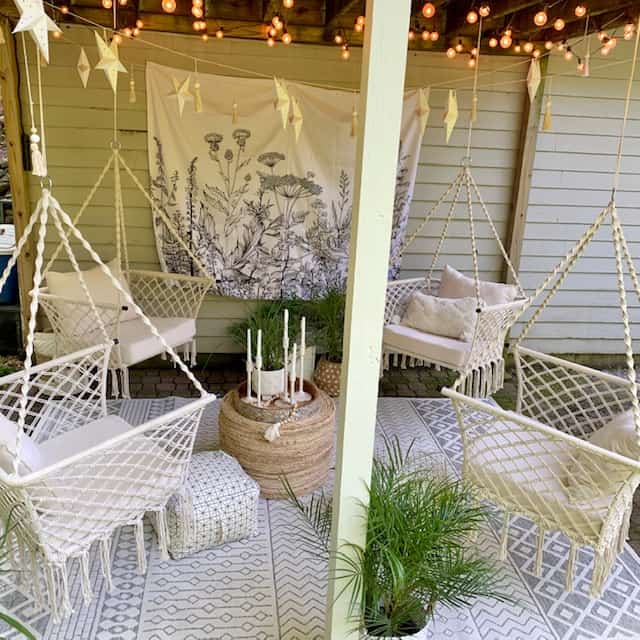 outdoor space featuring hanging chairs. 
