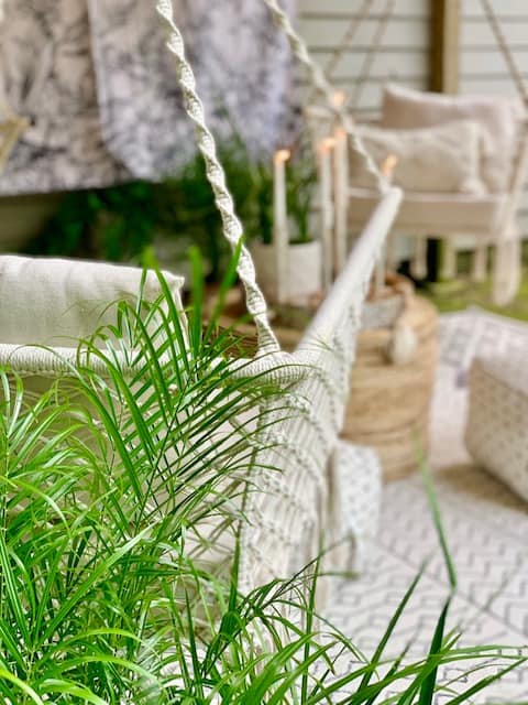 outdoor space with macrame hanging hammock chairs. 