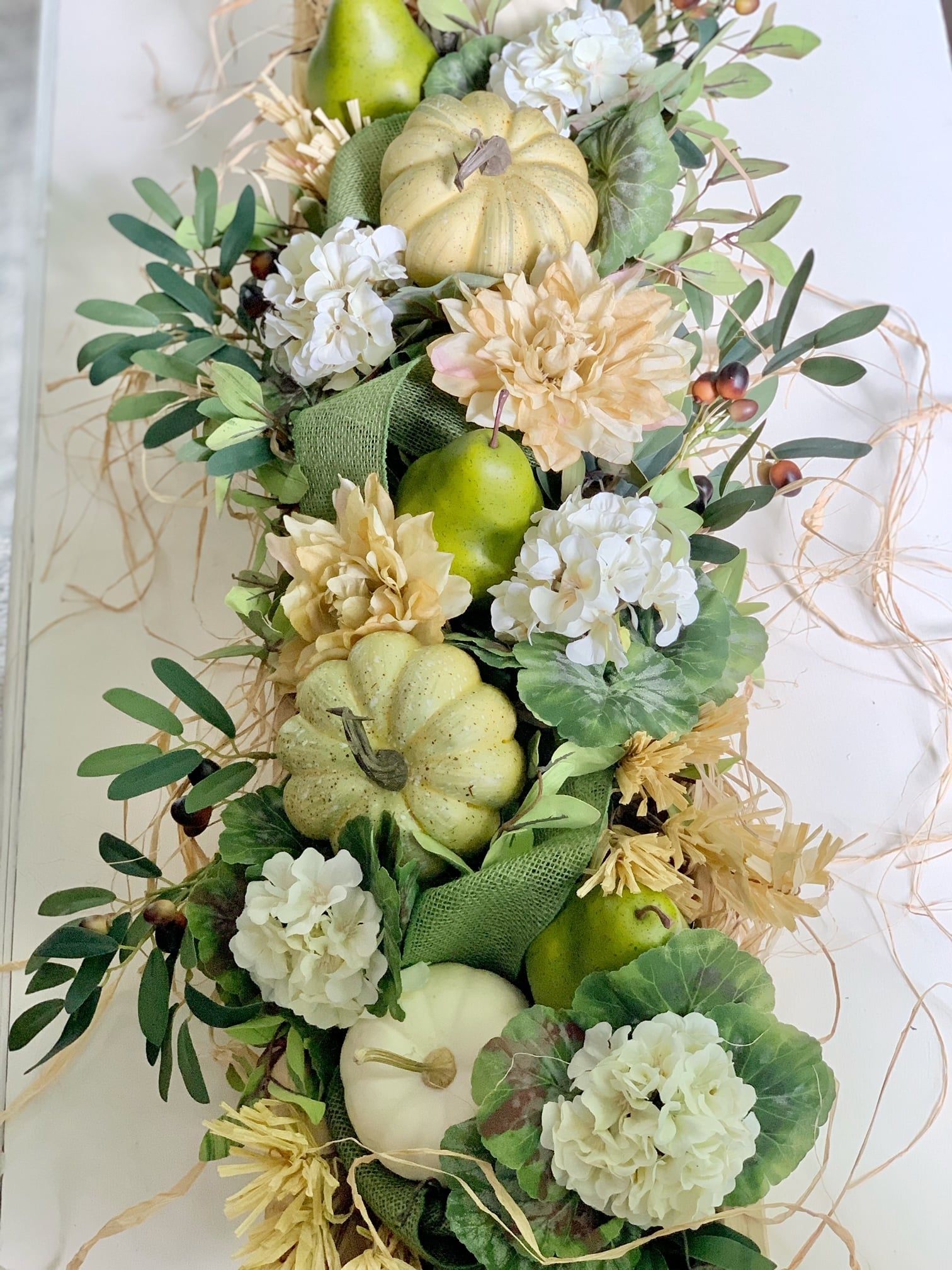 Top view of this dough bowl design. The colors are greens, whites and wheat color.
