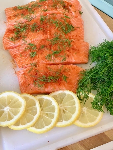 salmon fillets with dill and lemon slices