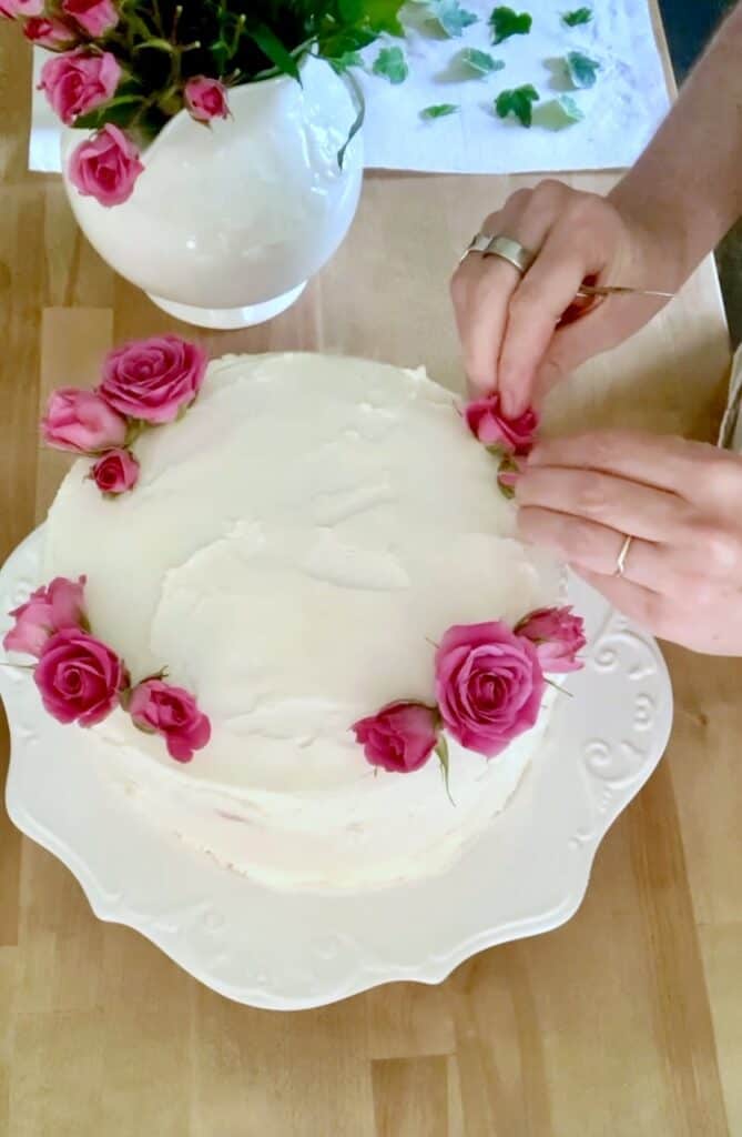 Me decorating a cake with roses. 