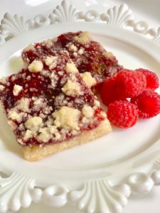 close up of two raspberry squares