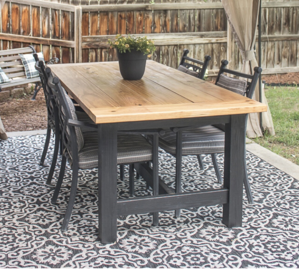 an outdoor table with thick black painted legs and a real wood top. This is my inspiration. 