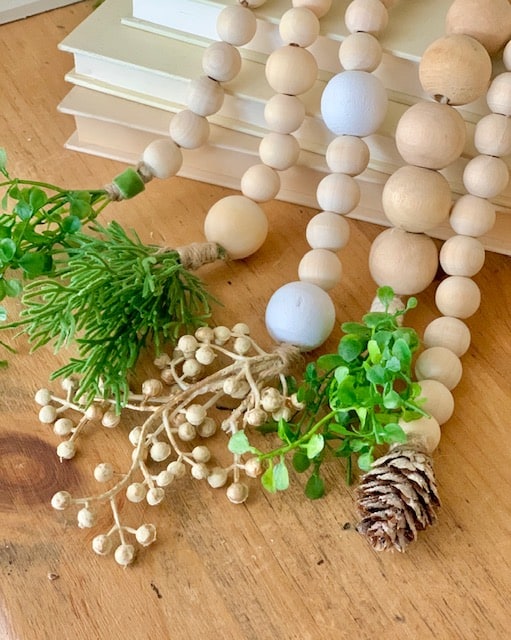 farmhouse decor wood beads with christmas greens and berries on the ends