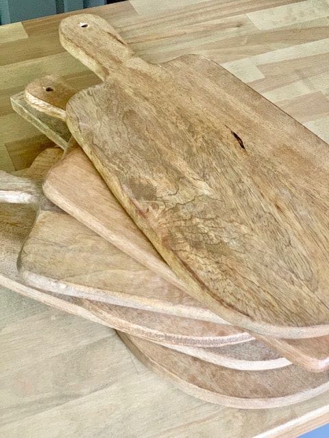 stack of plain bread boards ready to be transferred