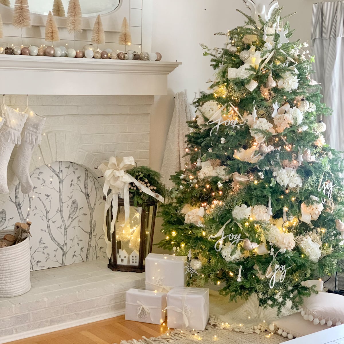 Our fresh Christmas tree all decorated with green and white ornaments and white hydrangea blooms. 