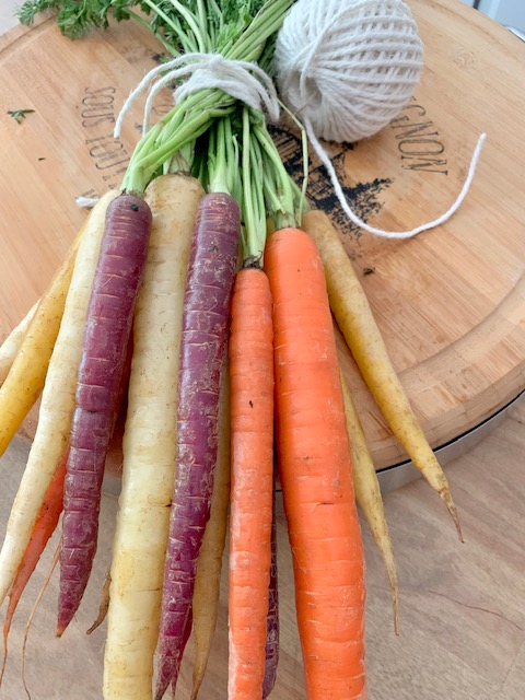 heirloom carrots wrapped with kitchen twine