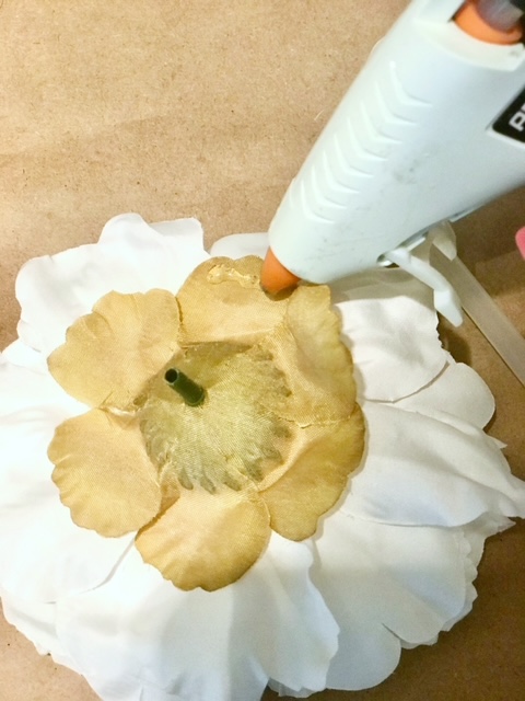 glueing the first peony. glue goes on the bottom of the flower head.