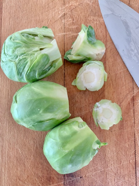 cutting the ends off of the brussel sprouts