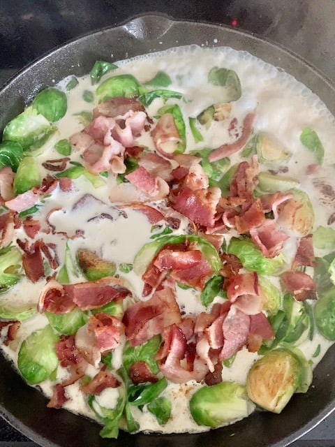 adding cream to brussel sprouts