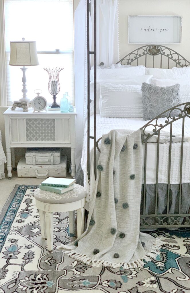 french country bedroom in gray, white and aqua accents.