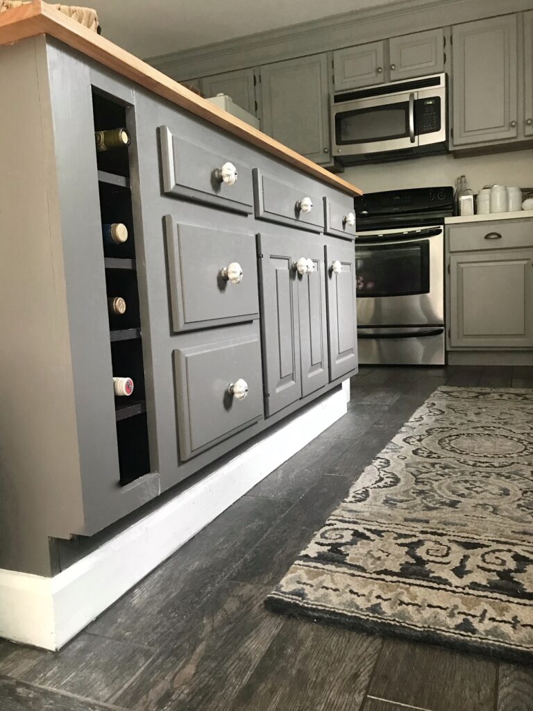a close up of the kitchen island showing the wine rack.