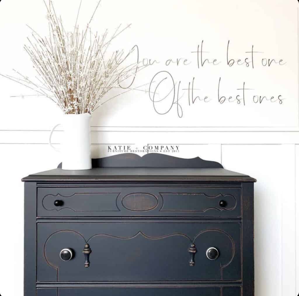a gorgeous antique dresser done with General finishes milk paint in Lamp black. 
