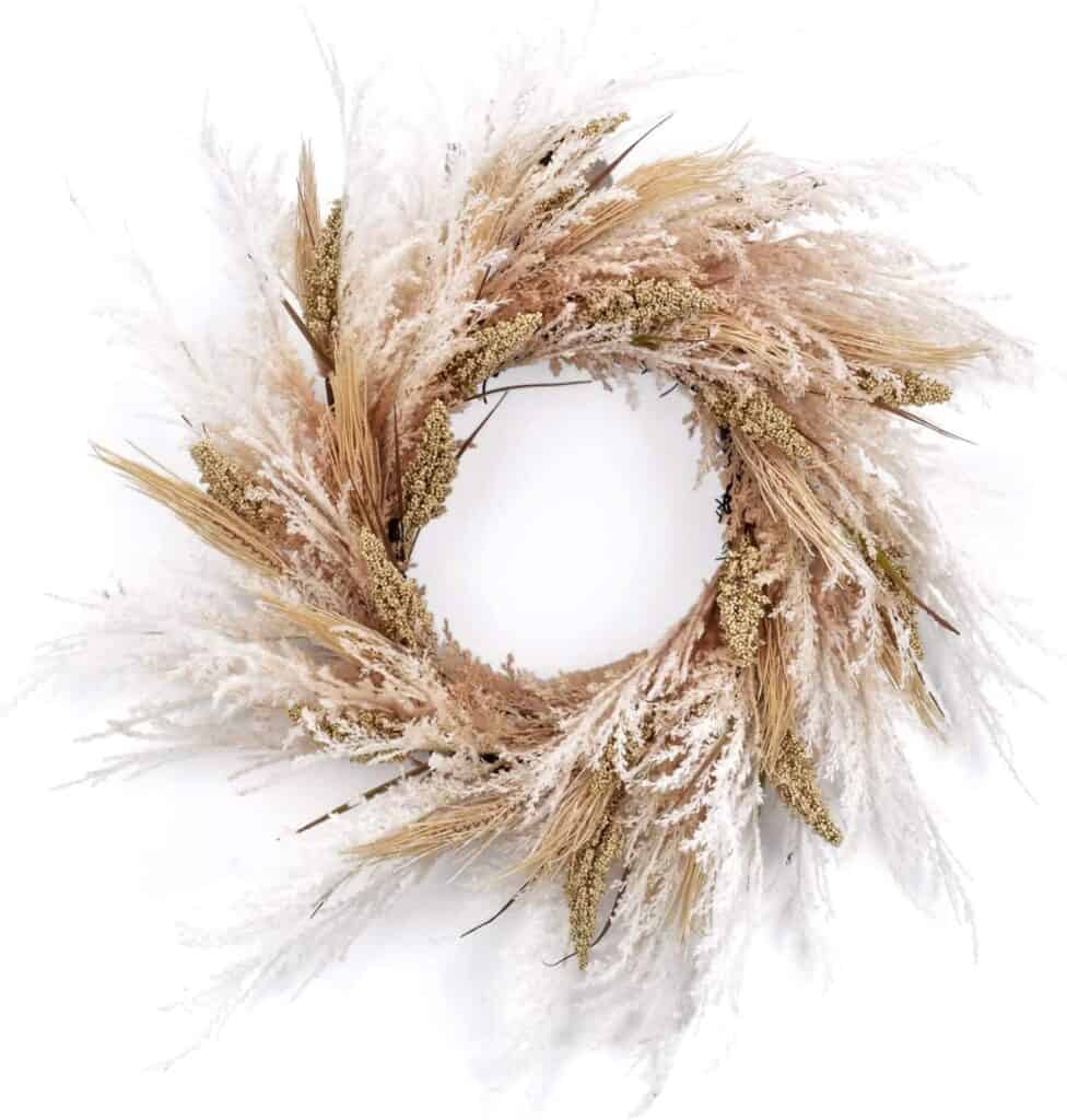 boho style wreath with plumes, berry branches and wheat. 