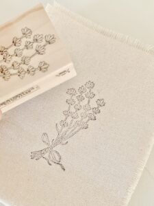 the printed lavender bundle using the wooden stamp.