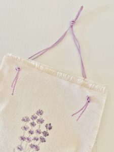 single completed sachet showing the purple string.