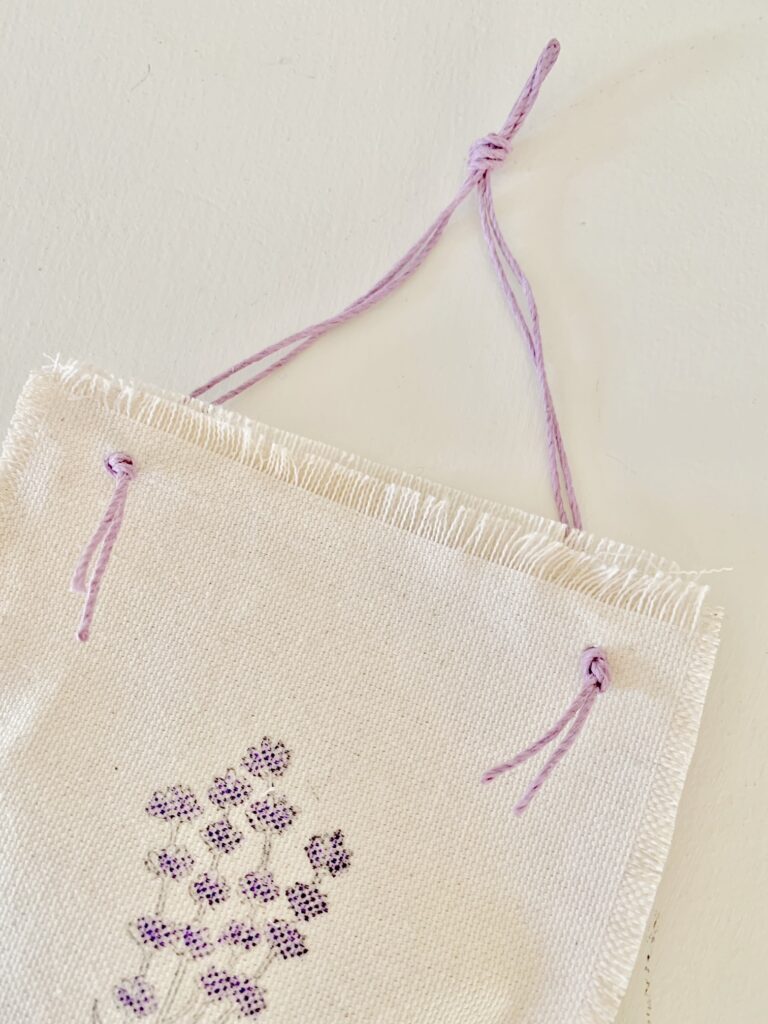single completed sachet showing the purple string.