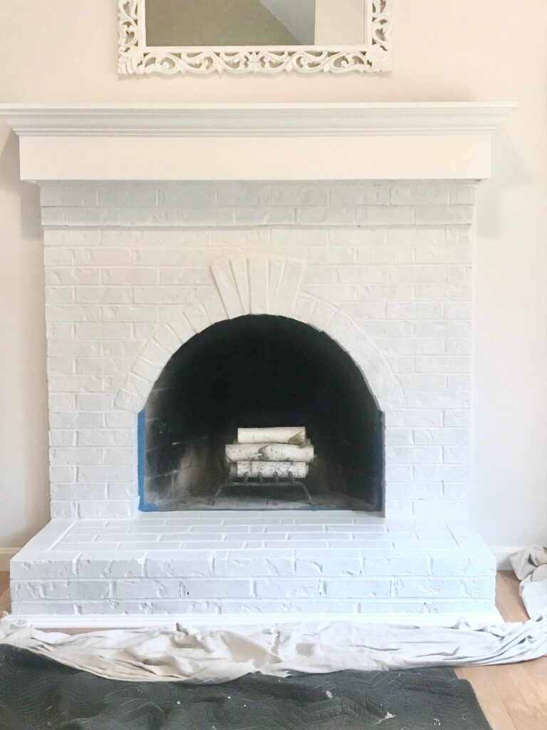 photo of finished white painted fireplace. 