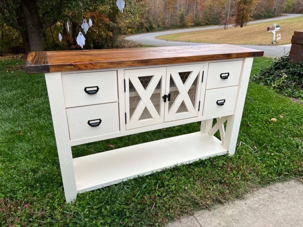 Farmhouse coffee bar painted white with wood top. 