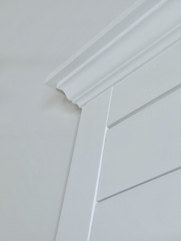 a close look at the left side of the overmantel's crown molding.