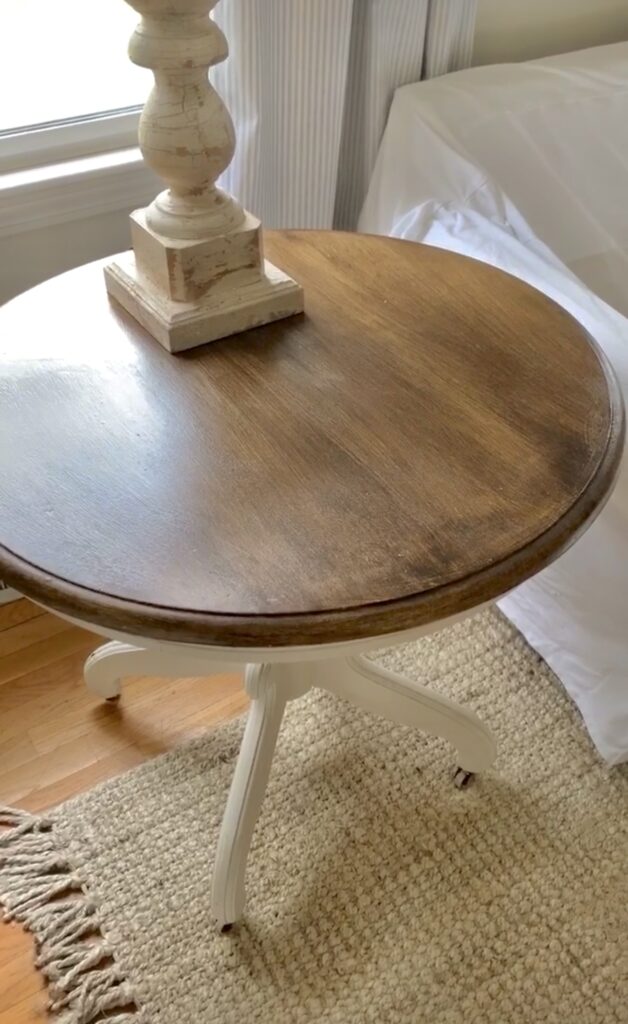 Faux wood finish table top on an antique side table.