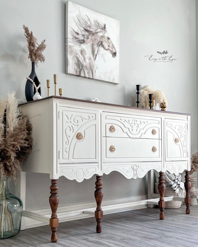 matching sideboard to the china cabinet done in white paint with raw wood details. 