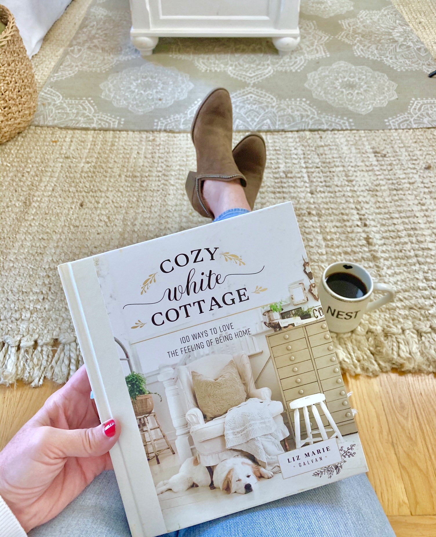 me holding cozy white cottage book from Liz marie galvin.