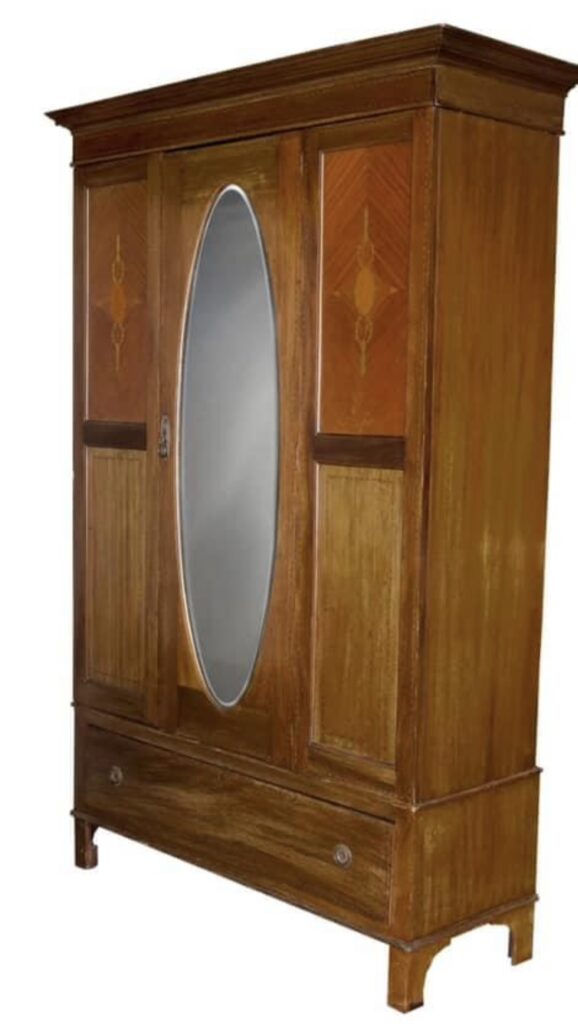 antique armoir with the same panel and oval mirror. 