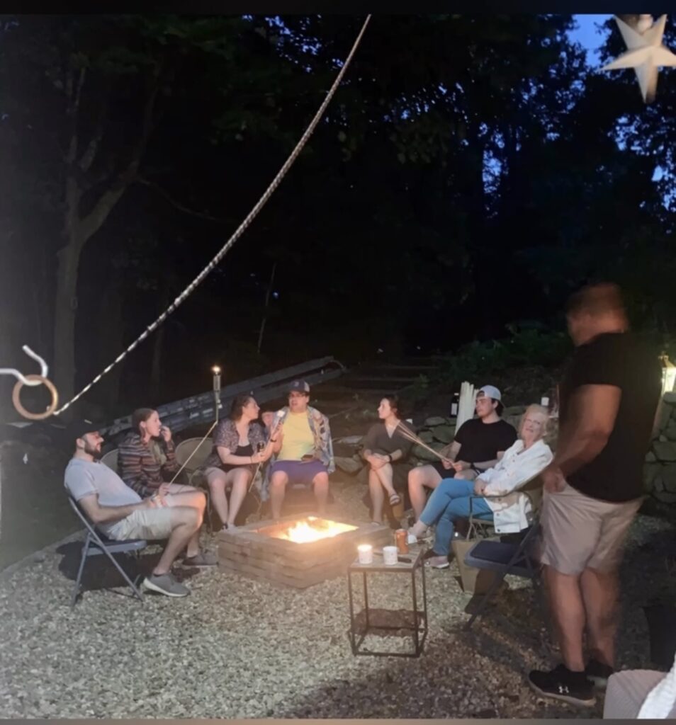 our family gathered round the fire pit at night. 