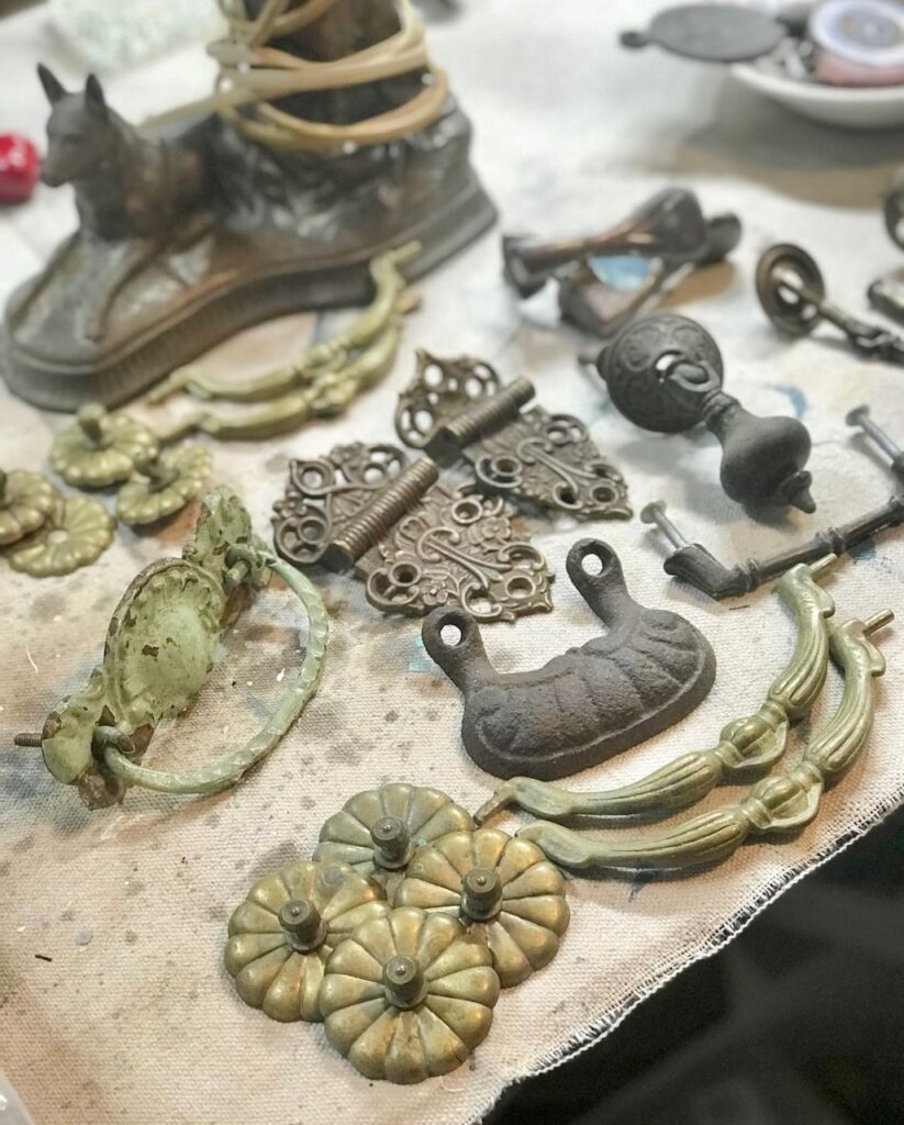 A collection of old drawer pulls and door knobs