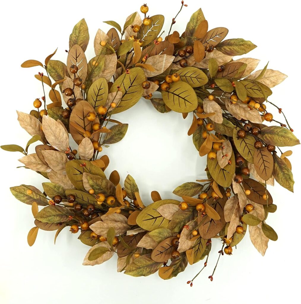 an olive and mustard tone wreath with eucalyptus, berries and magnolia leaves. 