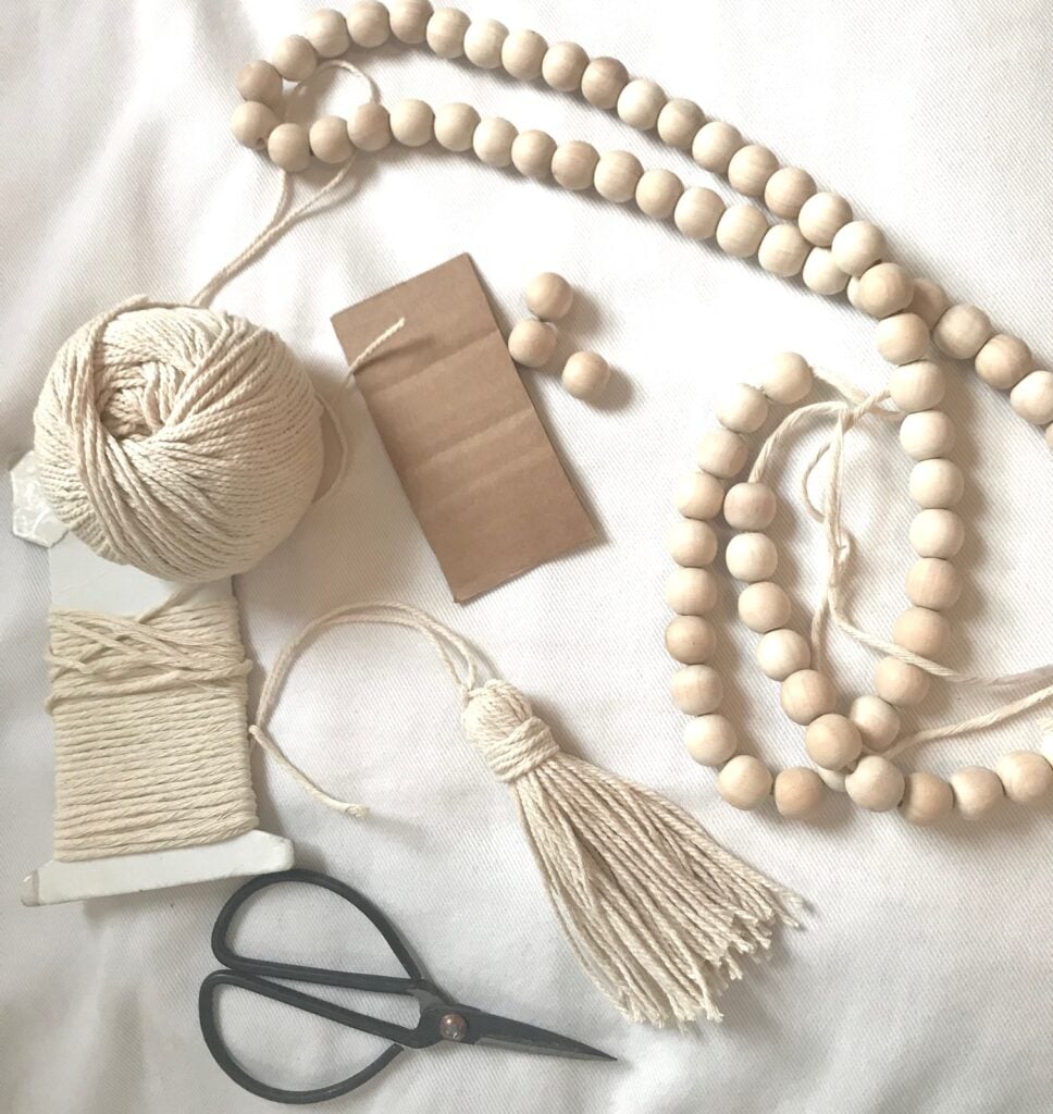 beads, string, cardboard and scissors to make tassels. 