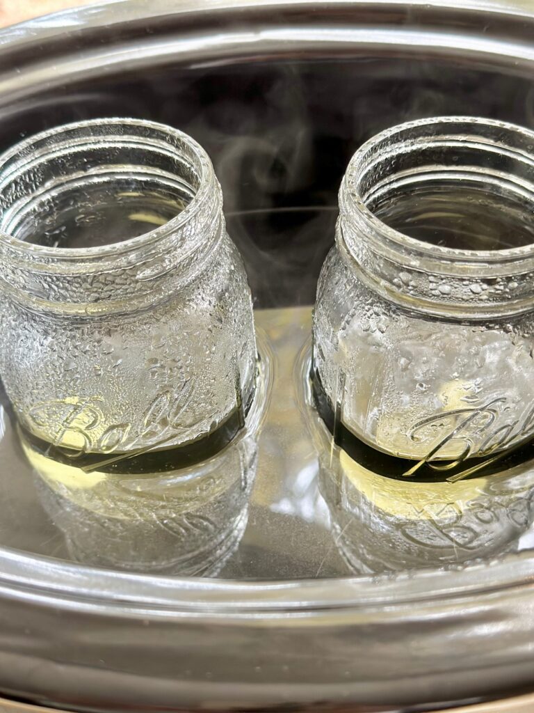 the wax has melted in the jars and reduced to a liquid that only folls half the jar. 
