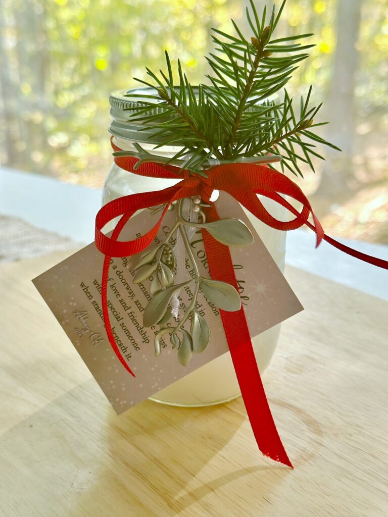 A piece of pine slipped behind the bow. this is the completed project for The Best Christmas Gifts for Teachers.