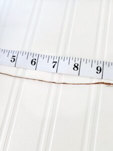 a measuring tape with the brown wire.