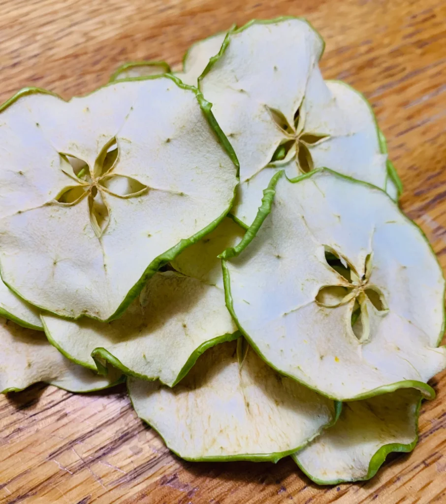 a pile of apple slices that have been dried. 
