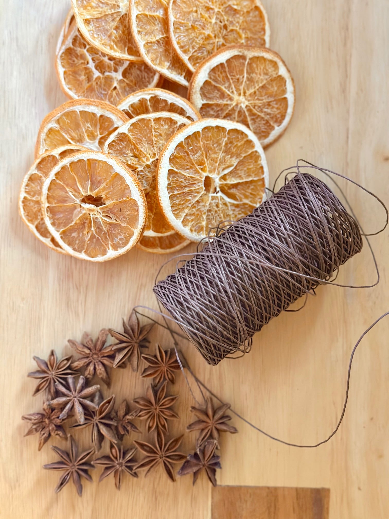 Supplies for a dried orange and star anise garland.