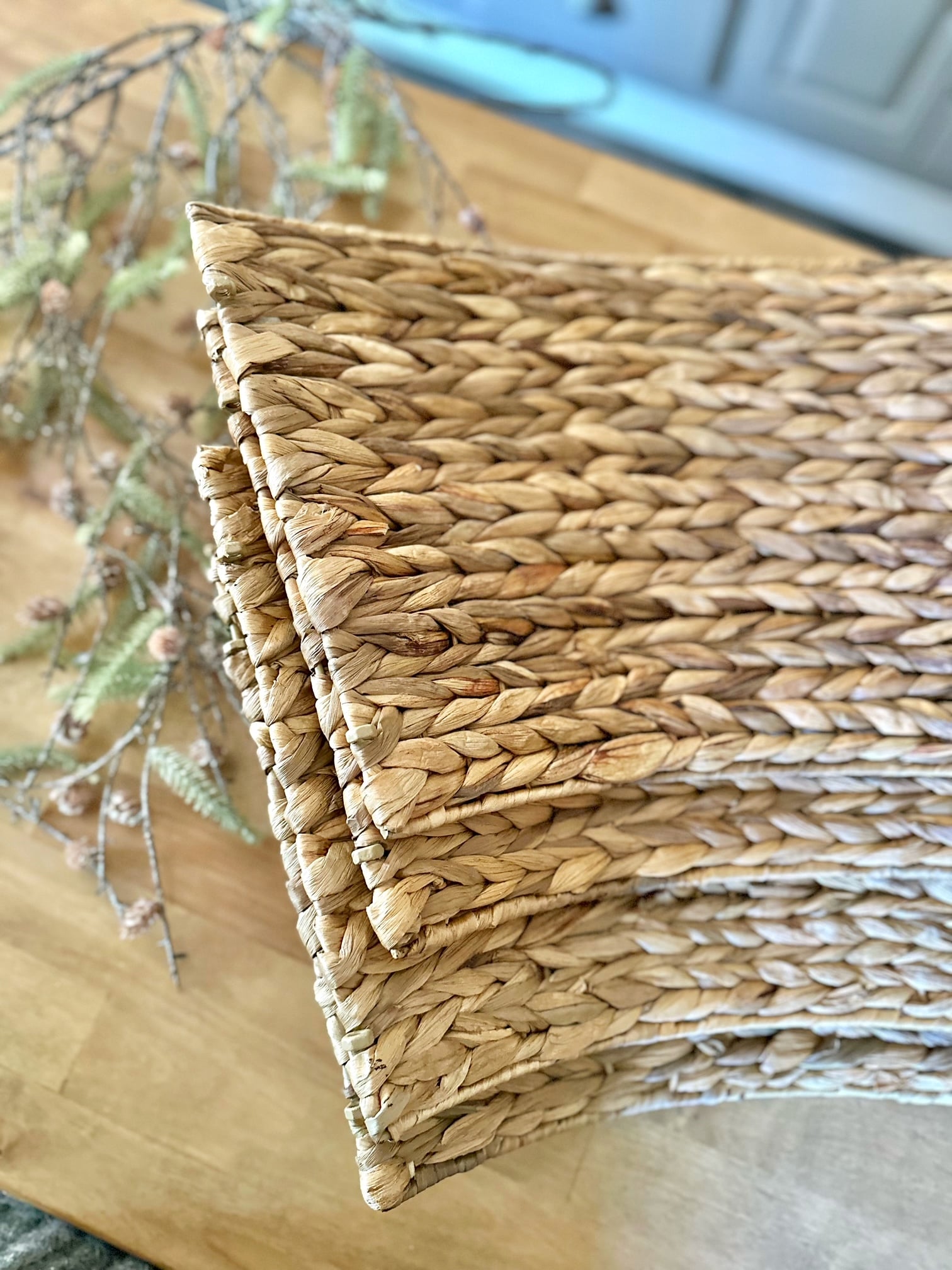 4 panels of a wicker tree collar stacked. 