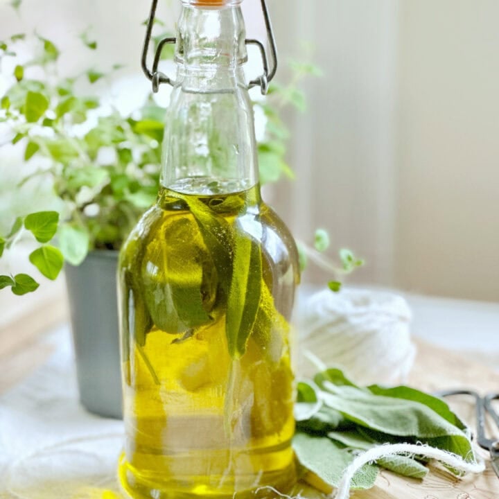Sage in a bottle with olive oil.