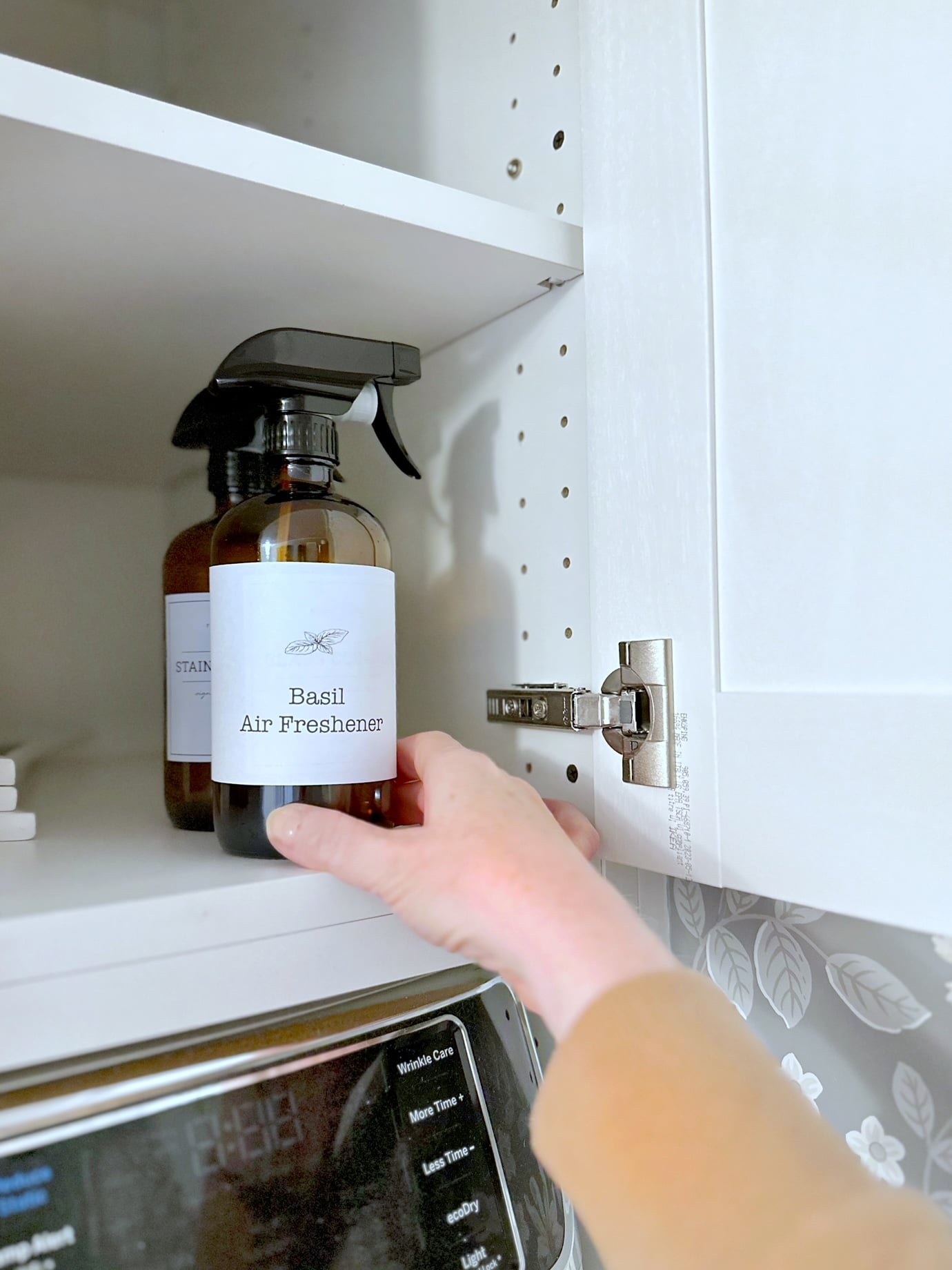 Storing basil air freshener in a cabinet in our laundry room.