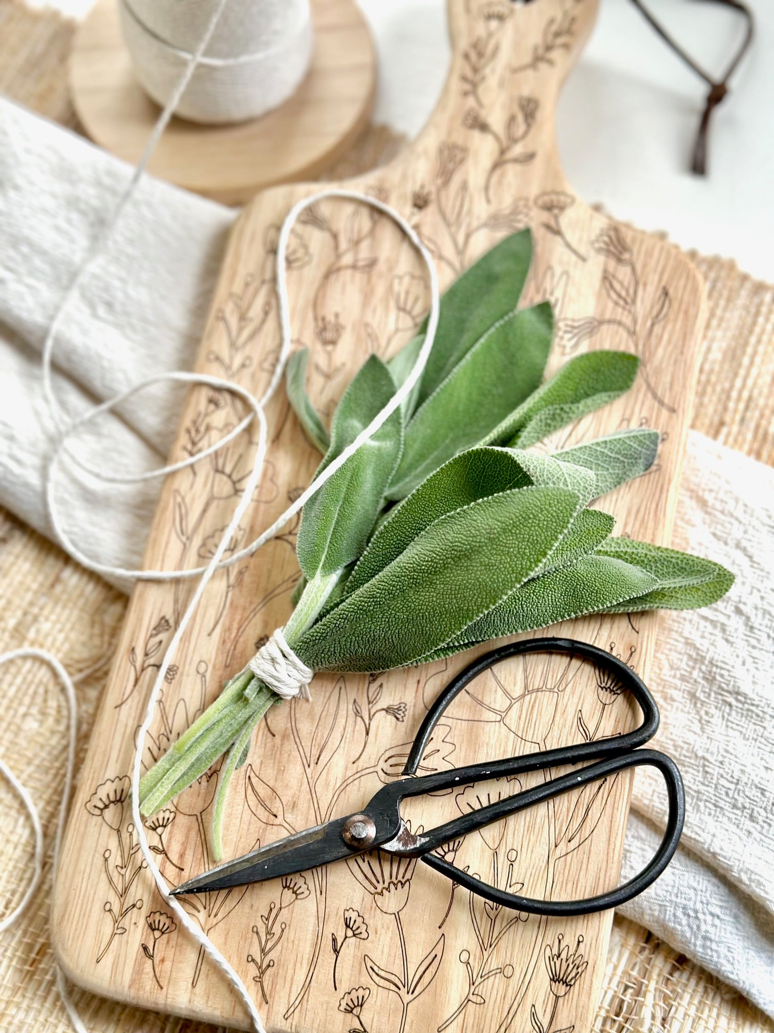 sage bundle, string and scissors.