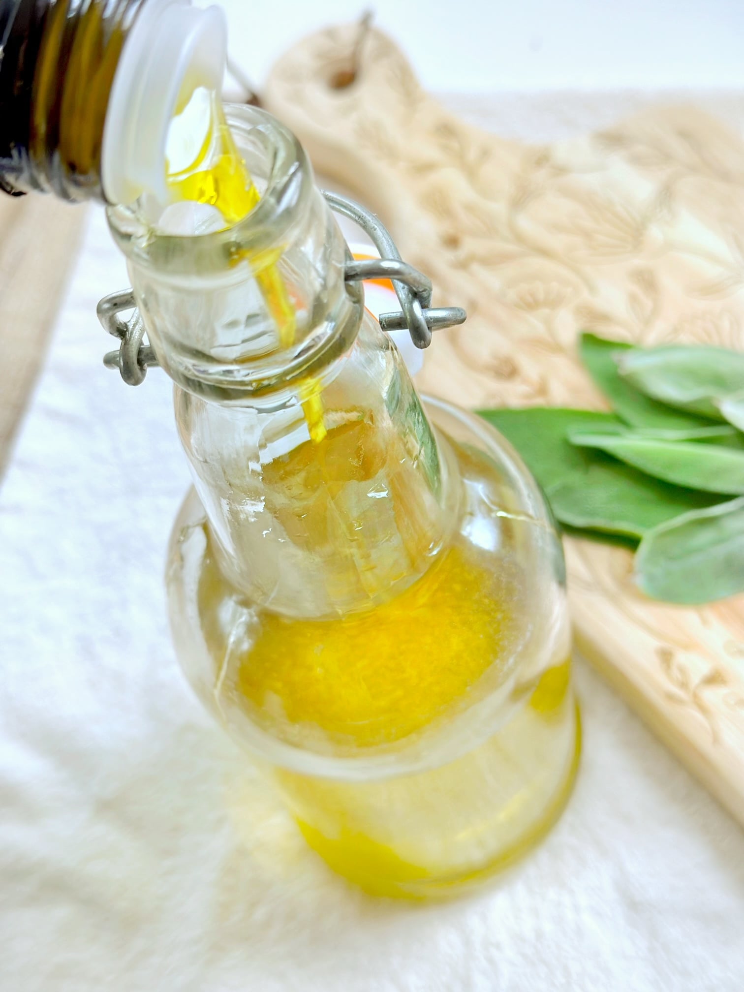 pouring oil in a bottle. 