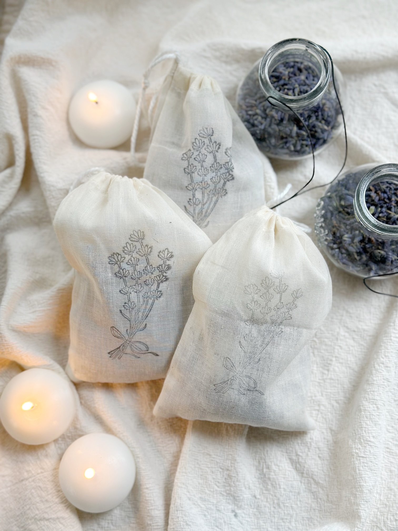 3 sachets with lavender and candles.