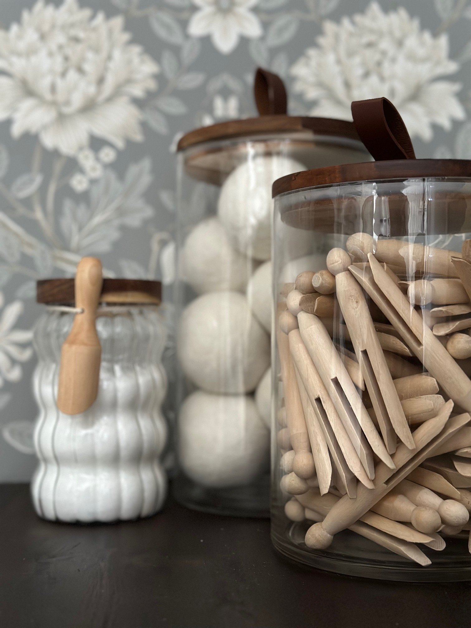 laundry room essentials, wool dryer balls, clothes pins, stain remover and laundry scent boost. 