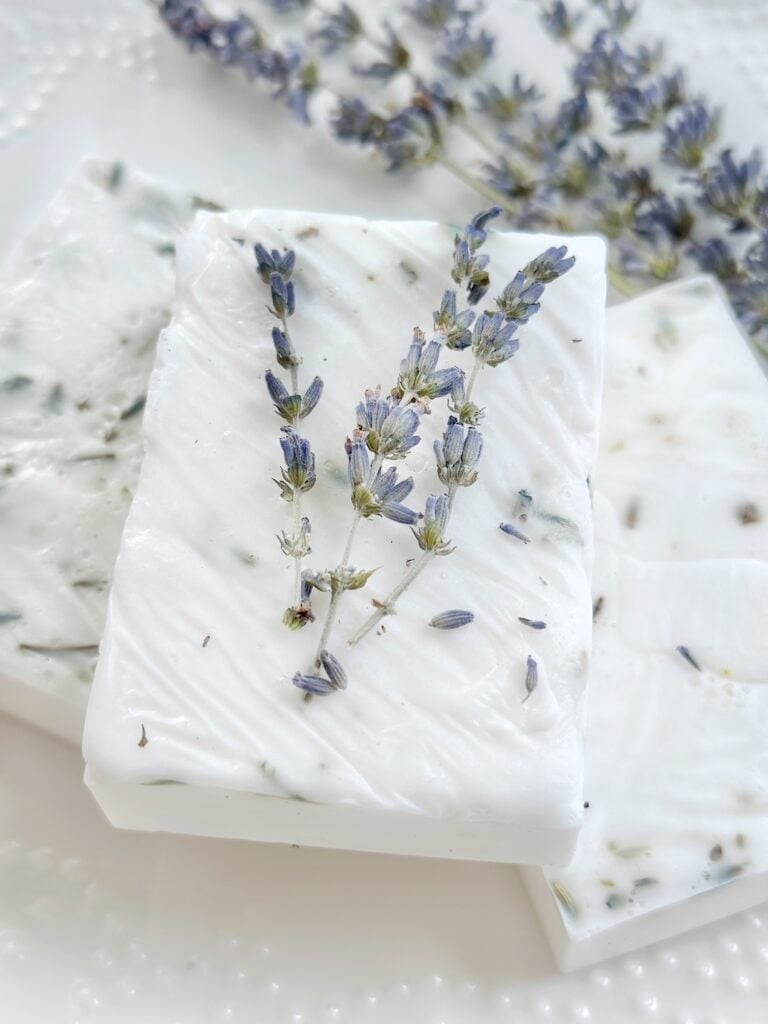 stack of soaps with lavender sprig.