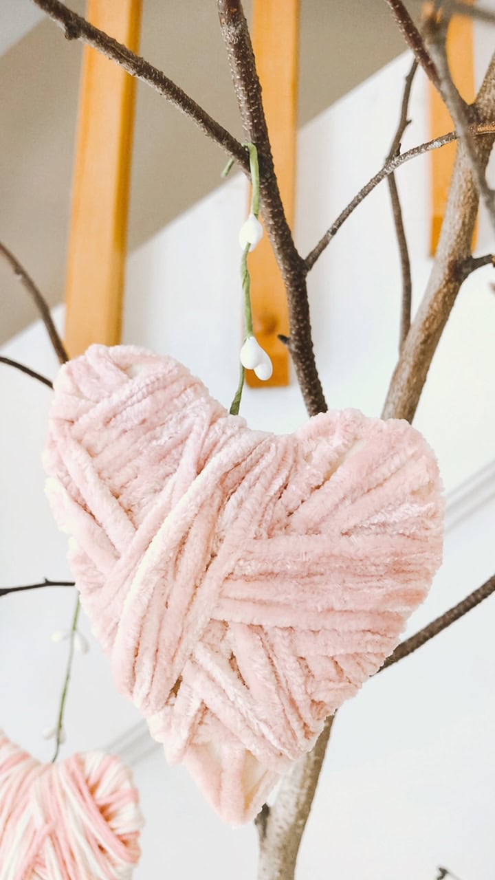 Hanging the heart with ribbon.