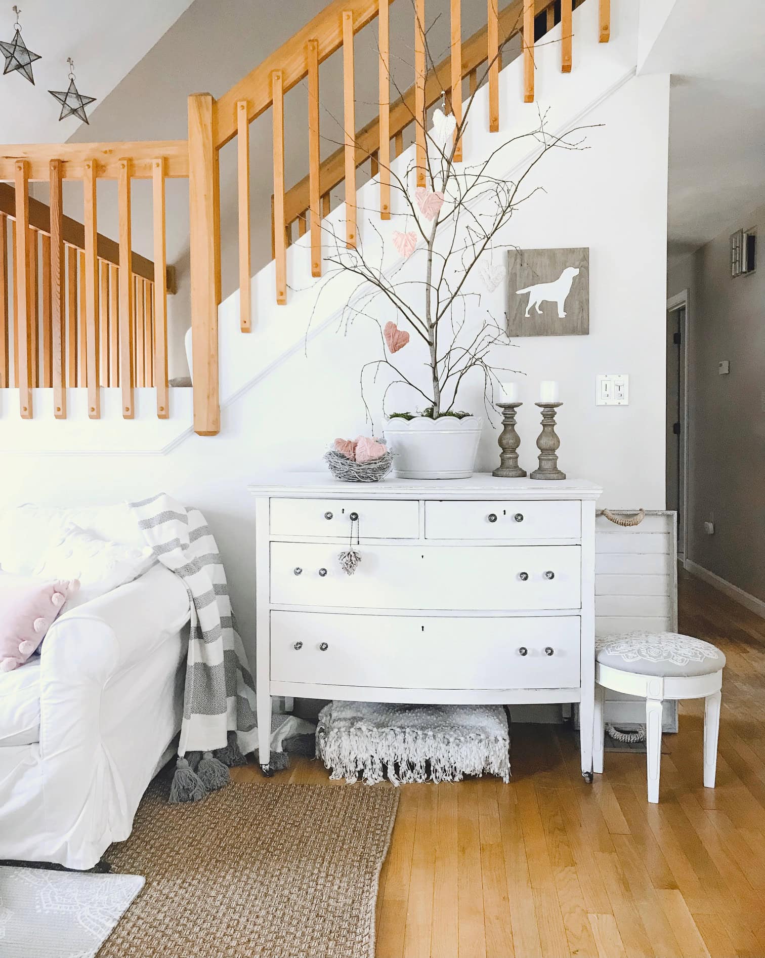 The Valentines day tree situated on an antique dresser.