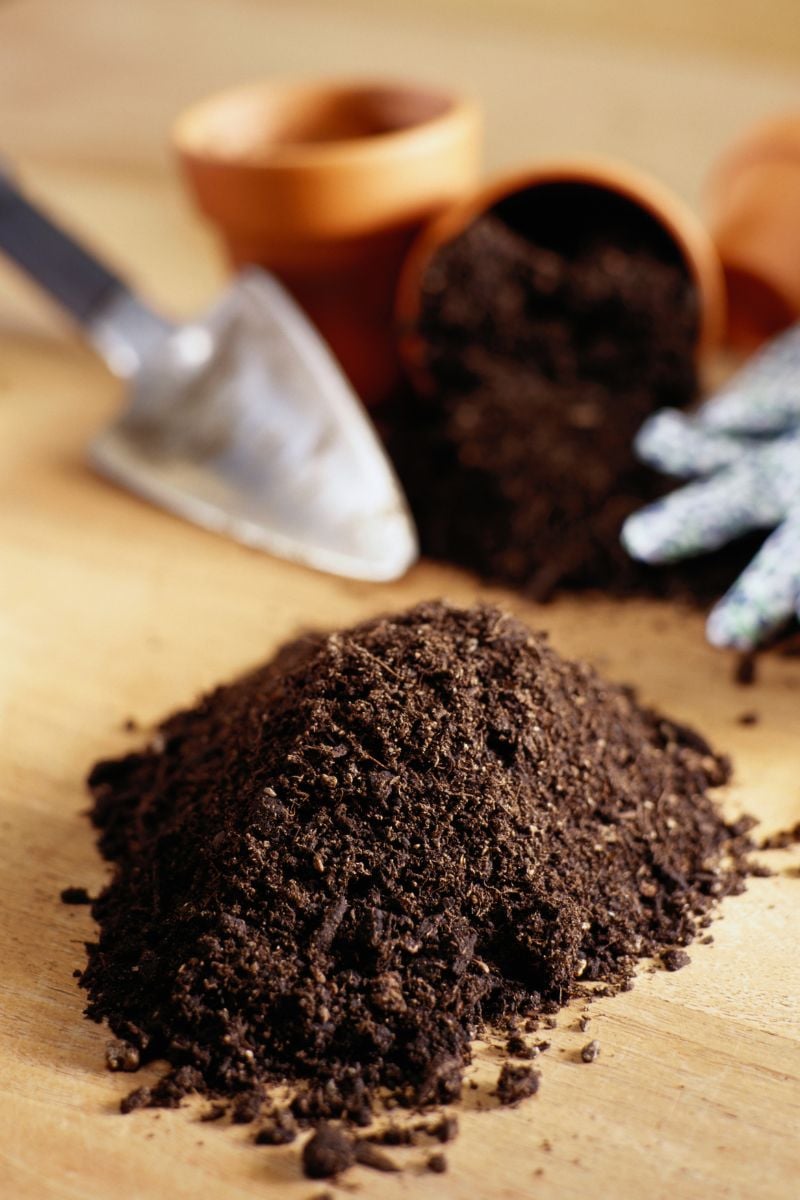 Soil, pots and a shovel.